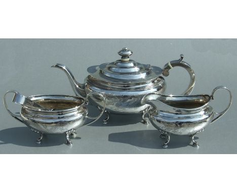 A Chinese four-piece silver tea set in George III Western taste, the teapot, cream jug and sugar bow all engraved with a drag