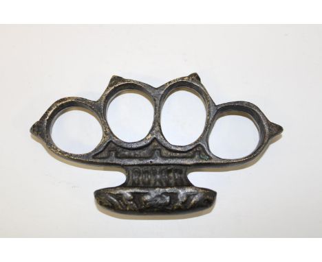 A heavy cast vintage knuckle duster 