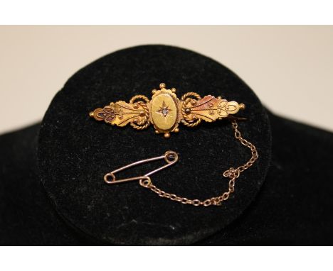 A vintage 9ct gold bar brooch 