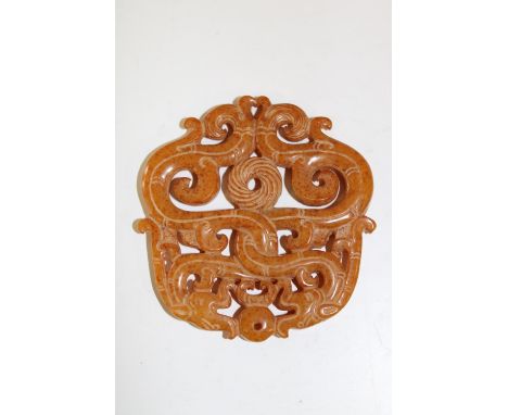 A double sided 19th century Chinese jade amulet with dragon decoration 