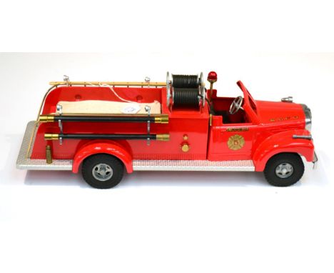 Smith Miller B-Mack Fire Pumper in Smith Miller Fire Department livery with wooden ladder, twin hose reel, cotton hose and ot