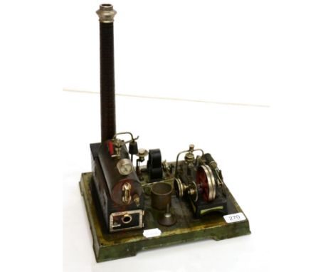 Doll Live Steam Engine consisting of horizontal boiler mounted on brick effect plinth with chimney connected to a single hori