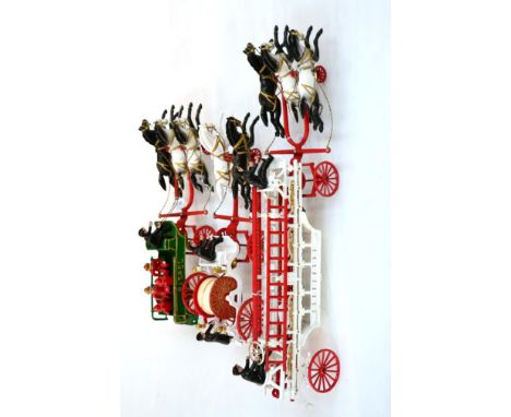 Carpenter (Reproduction) Cast Iron Hook & Ladder Truck with three horses abreast, main body with two ladders to sides, two in
