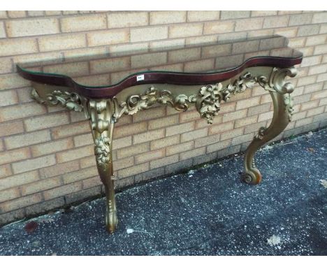 A console table of serpentine outline, approximately 89 cm x 154 cm x 45 cm.