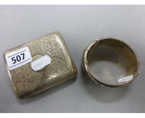 A silver bangle and silver cigarette case 