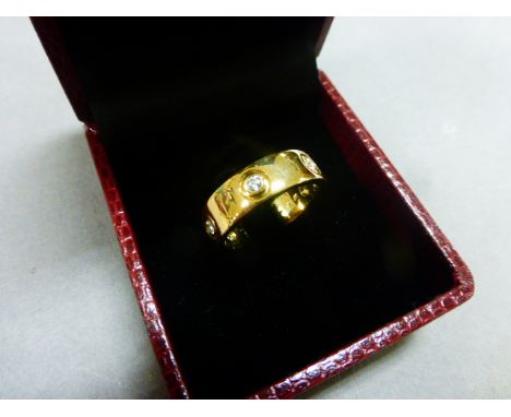 A 9ct yellow gold full eternity  love ring, set with 40 points of diamonds