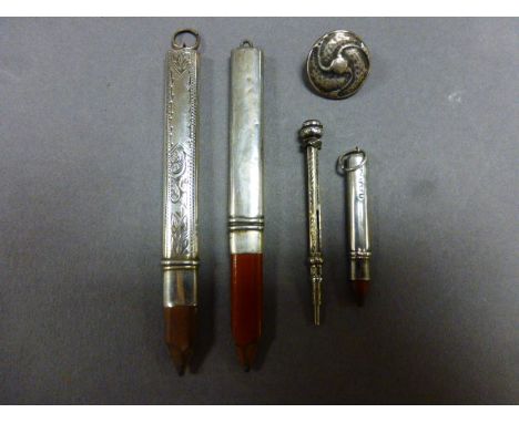 A Silver Liberty & Co "Cymric" button, along with various silver pencils 