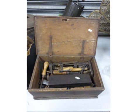 A vintage wooden tool box and tools