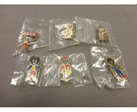 Six enamel Golly badges