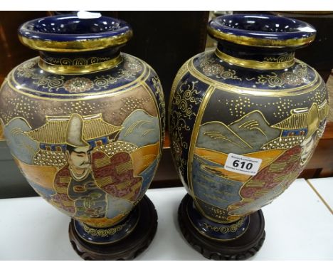 A pair of Chinese vases decorated in enamel relief of male figure