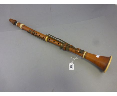 A wooden clarinet with ivory mounts by Dean & Company 