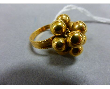 A cluster ring formed of 10 sphere balls, with Arabic markings 