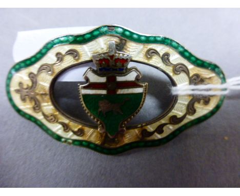 An early 20th century enamel brooch, with crest to the centre with lion and St George flag, the reverse marked "sterling"