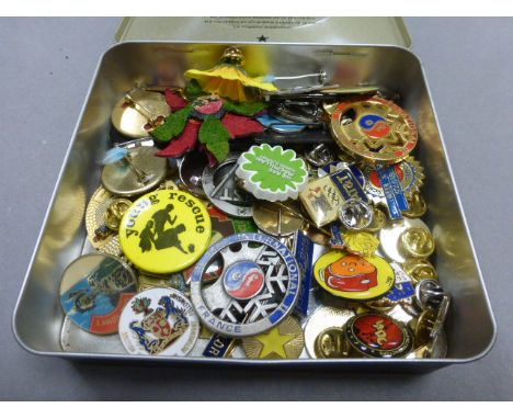 Tin containing quantity of badges including enamel