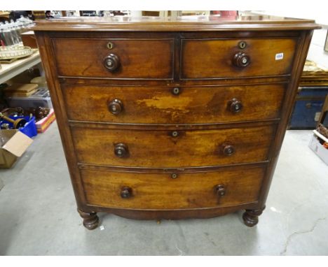 A Victorian mahogany bow front chest of drawers with inlaid mother of pearl of handles