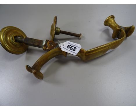 A vintage brass door knocker