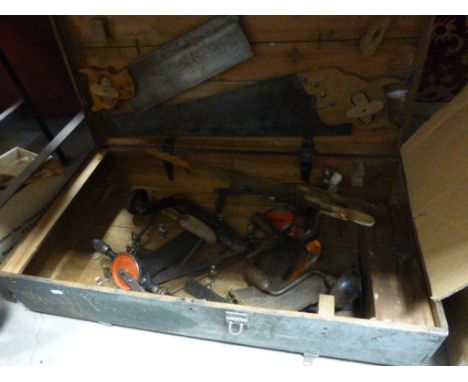 A vintage wooden tool box with various tools 