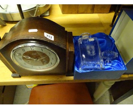A boxed glass decanter and stopper engraved Bristol University, along with an oak mantel clock