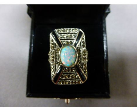 A silver, marcasite and central opal Art Deco style ring