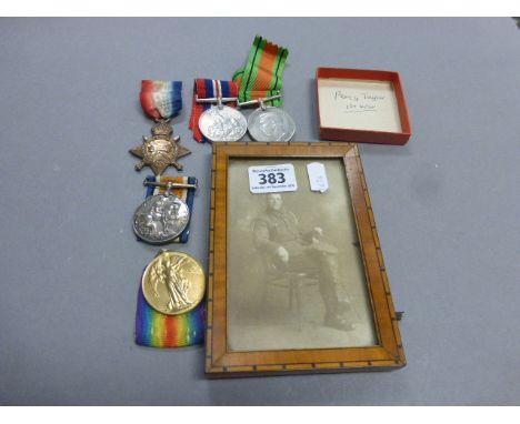 WW1 medal trio with framed photograph, plus WW2 medals in Air Raid Precautions box