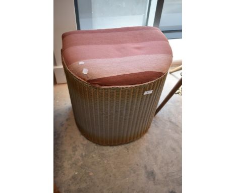 A vintage Lloyd Loom half moon linen basket stool