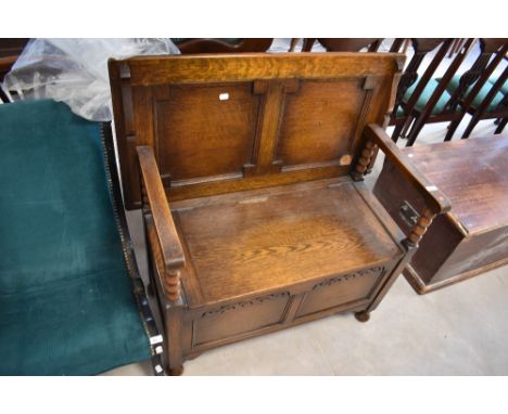 An early to mid 20th Century oak monks bench