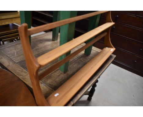 A stripped Ercol wall shelf, width approx. 97cm