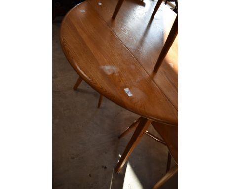 An Ercol drop leaf dining table