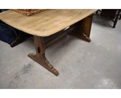 A part stripped Ercol refectory style dining table