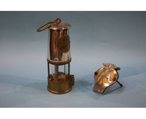 An Eccles Miners lamp and an AA badge