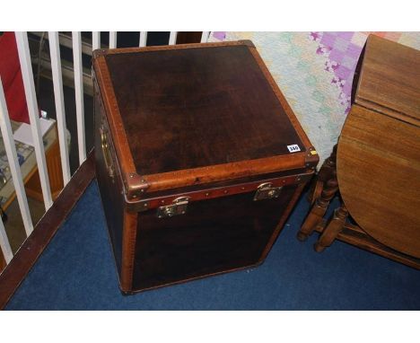 A modern brown leather studded trunk