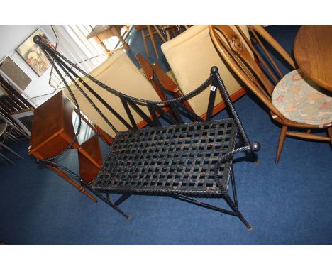 A metalwork two seater bench