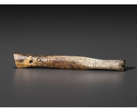 A JADE 'FISH' PENDANT, LATE SHANG TO EARLY WESTERN ZHOU DYNASTYChina, 1200-1100 BC. Of slender form with a long snout, pierce