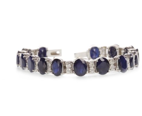 IMPRESSIVE SAPPHIRE AND DIAMOND BRACELETset with oval faceted sapphires, each approximately 1.90 carats and interspaced by pa
