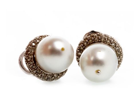 PAIR OF PEARL AND DIAMOND STUD EARRINGSeach sent with a central spherical grey pearl to grain set diamond settings, each 13.8