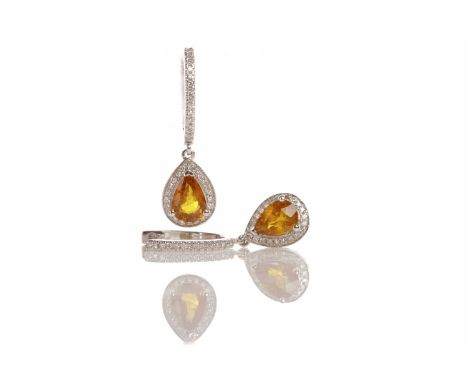 PAIR OF YELLOW SAPPHIRE AND DIAMOND EARRINGSeach of hoop form, set with round brilliant cut diamonds with a suspended yellow 