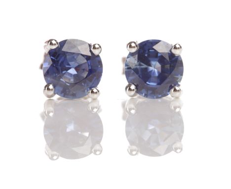 PAIR OF SAPPHIRE SINGLE STONE EARRINGSeach set with a single round faceted sapphire 6.3mm diameter, the sapphires totalling a