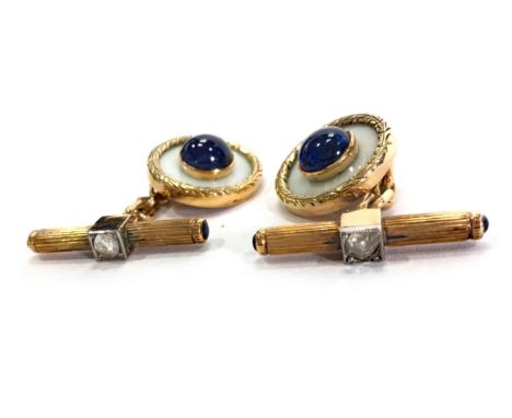 PAIR OF SAPPHIRE, ENAMEL AND DIAMOND CUFF LINKSeach formed by a circular enamelled section with central cabochon cut sapphire