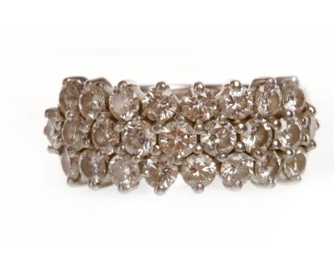 PLATINUM DIAMOND SET BAND set with three rows of round brilliant cut diamonds totaling approximately 2.00 carats, size K, app