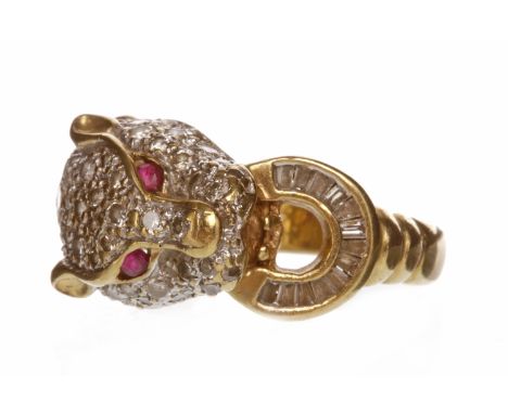 DIAMOND SET PANTHER MOTIF RINGthe head with pave set diamonds all over and with ruby eyes, the mouth grasping a crescent shap