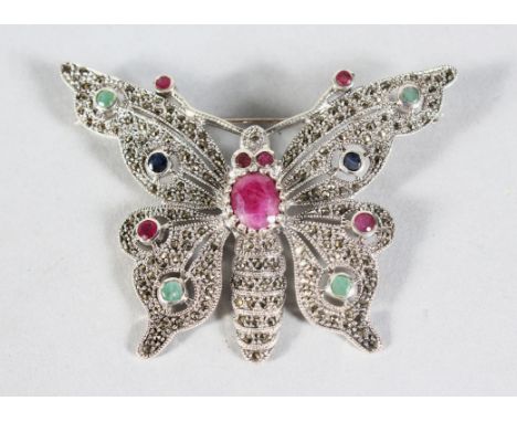 A LARGE SILVER, RUBY, EMERALD AND SAPPHIRE BROOCH.