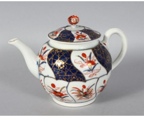 AN 18TH CENTURY WORCESTER TEAPOT AND COVER, painted with panels in imari style.