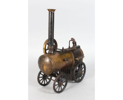 AN EARLY TIN PLATE MODEL OF A STEAM TRACTION ENGINE. 9ins long.