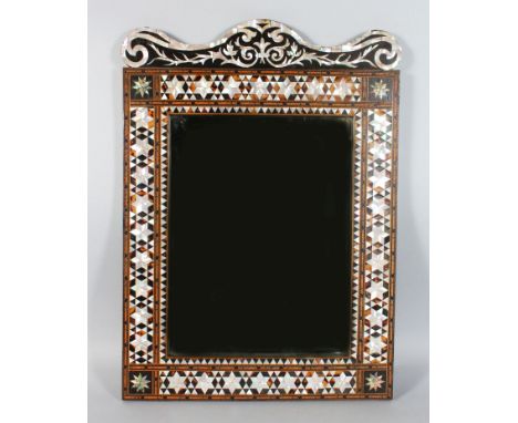 A TURKISH WALL MIRROR, with mother-of-pearl and tortoiseshell inlaid frame. 27ins x 19ins.