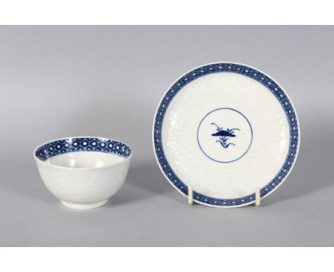 A GOOD 18TH CENTURY WORCESTER TEA BOWL AND SAUCER, printed with a landscape in blue and white.