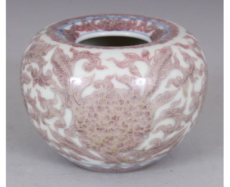 A CHINESE COPPER RED & UNDERGLAZE-BLUE PORCELAIN WATER POT, the sides decorated with formal scrolling flowerheads, the base w