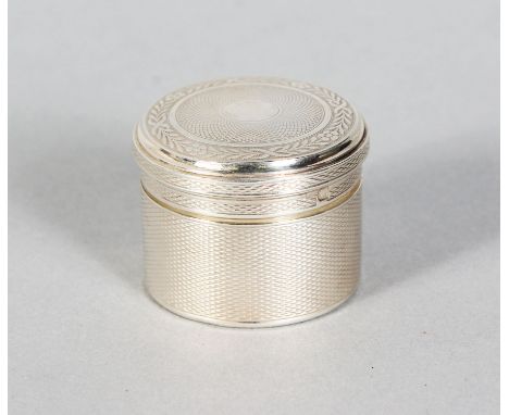 AN ENGINE TURNED PILL BOX by G. KELLER, PARIS. 1.5ins diameter.