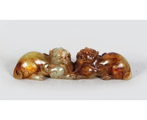 A PAIR OF CHINESE JADE FOO DOGS. 4.5ins long.