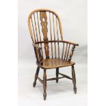 AN 18TH CENTURY WINDSOR TALL SPINDLE BACK ARMCHAIR.