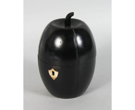 AN EBONISED MELON SHAPE TEA CADDY. 6.5ins high.